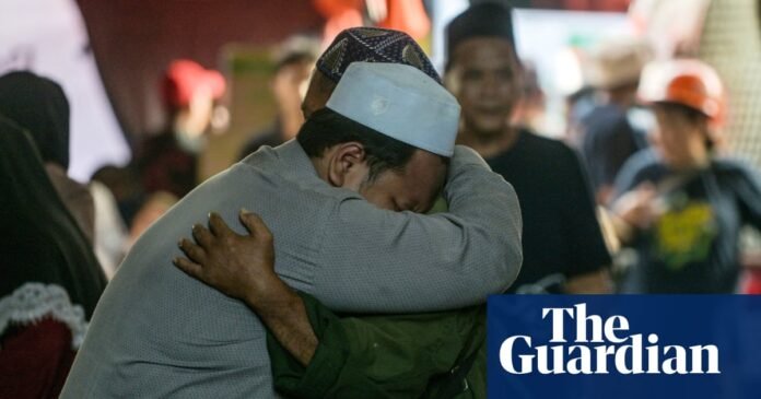 Rescuers search for survivors at the boarding school in Sidoarjo, East Java.